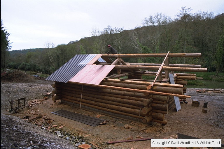 Fitting roofing sheets.